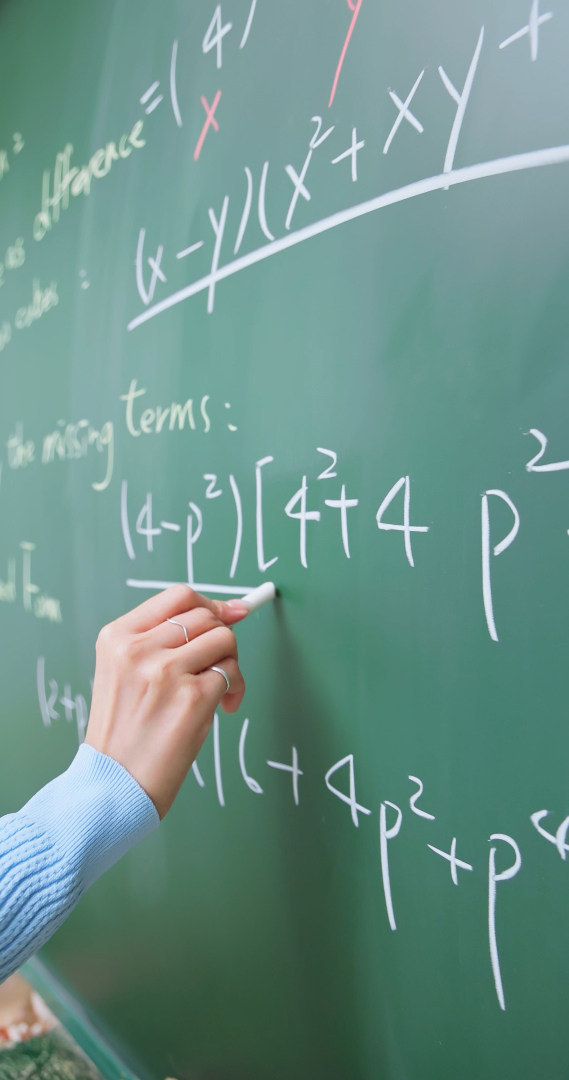 Teacher Draws on Blackboard